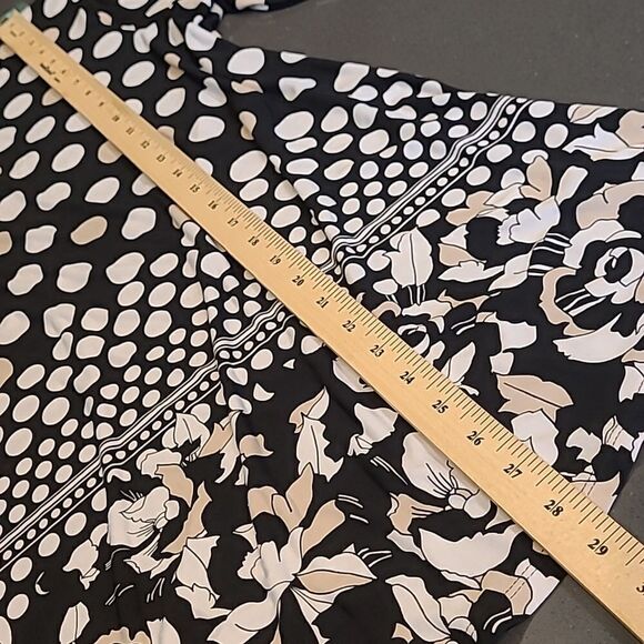 Black with cream polkadots with floral detailing around hem.  Peekaboo sleeves - Picture 4 of 10